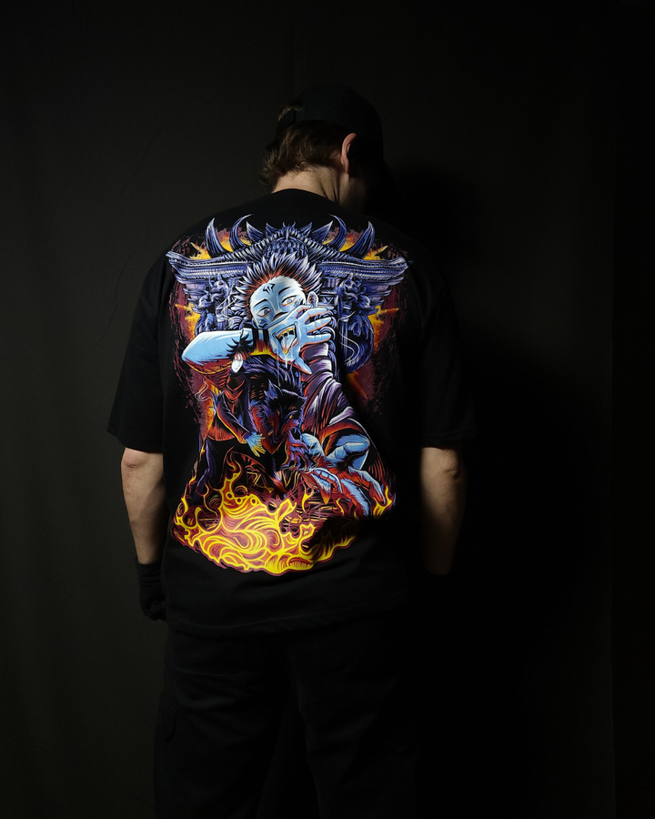 Anime-inspired apparel featuring bold back artwork, worn by a model in a dark studio setting – from a South African anime clothing brand.