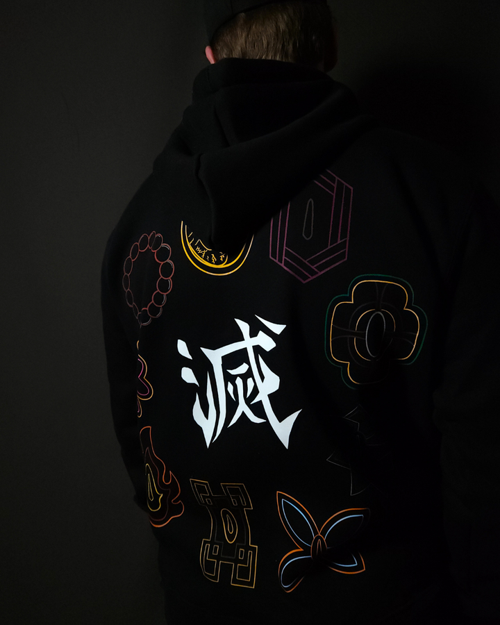 Anime-inspired apparel featuring bold back artwork, worn by a model in a dark studio setting – from a South African anime clothing brand.