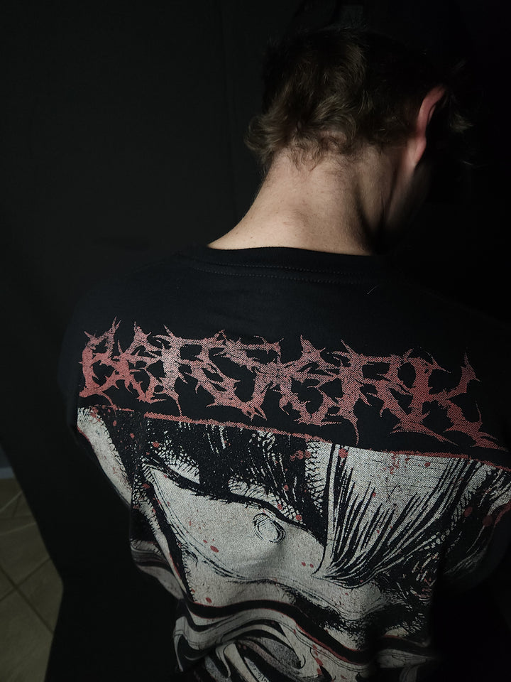 Anime-inspired apparel featuring bold back artwork, worn by a model in a dark studio setting – from a South African anime clothing brand.