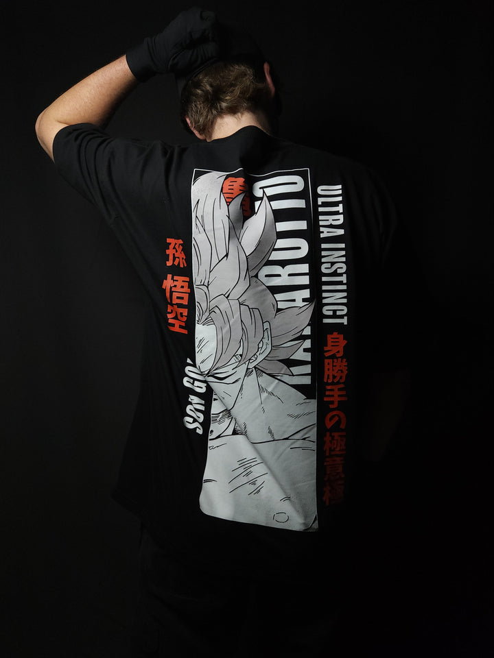 Anime-inspired apparel featuring bold back artwork, worn by a model in a dark studio setting – from a South African anime clothing brand.