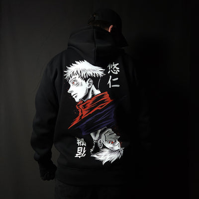 Anime-inspired apparel featuring bold back artwork, worn by a model in a dark studio setting – from a South African anime clothing brand.