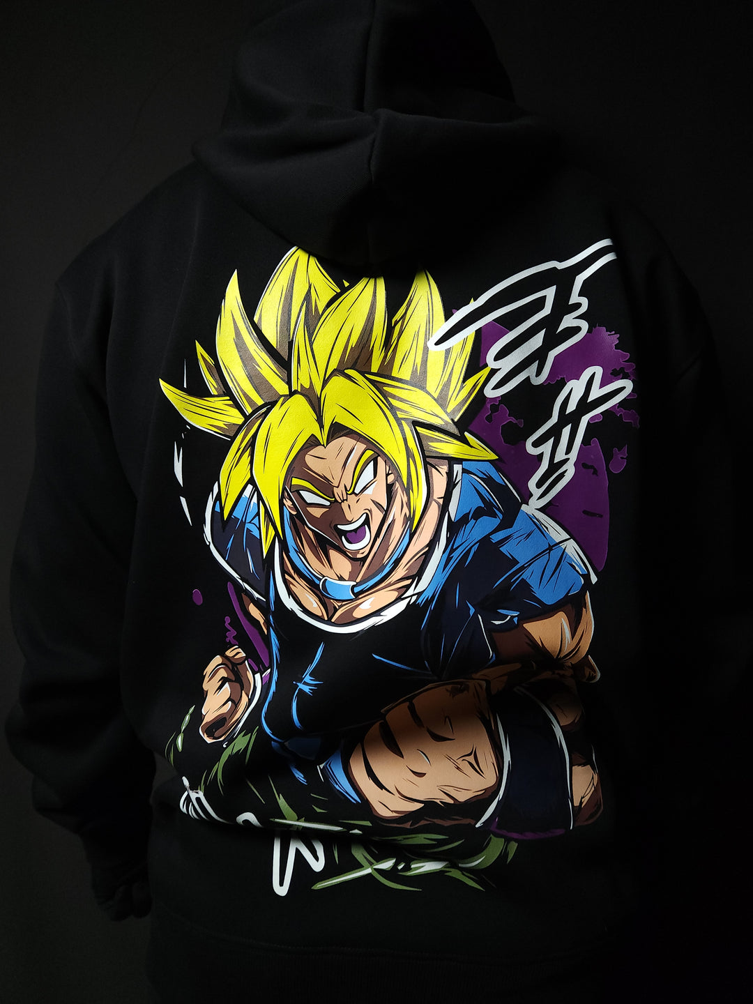 Anime-inspired apparel featuring bold back artwork, worn by a model in a dark studio setting – from a South African anime clothing brand.
