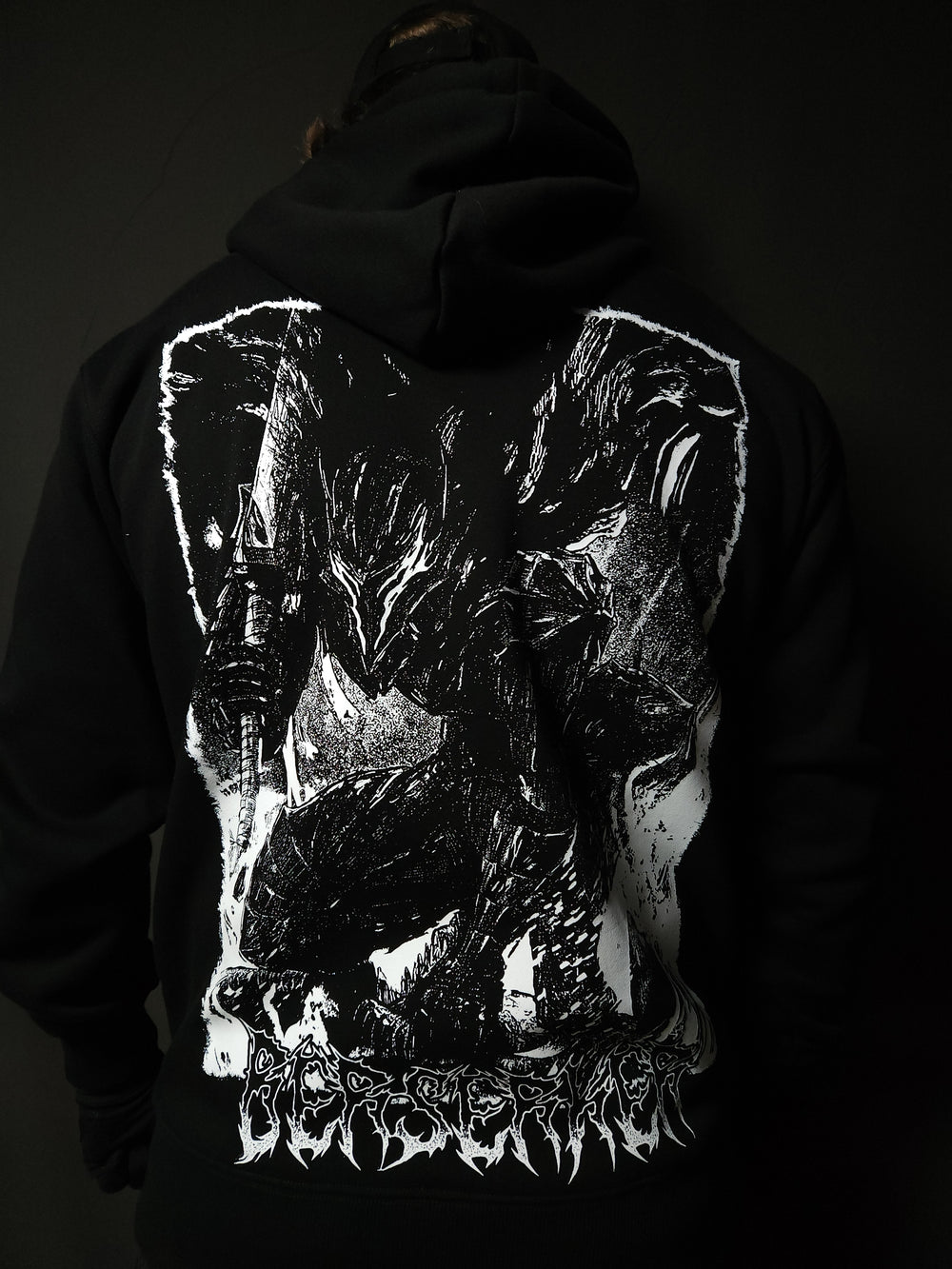 Anime-inspired apparel featuring bold back artwork, worn by a model in a dark studio setting – from a South African anime clothing brand.