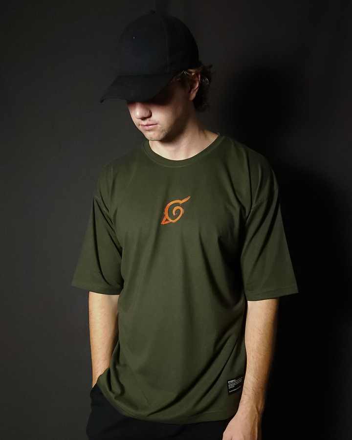 Anime-inspired apparel featuring bold Naruto back artwork, worn by a model in a dark studio setting – from a South African anime clothing brand.